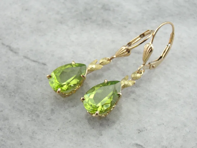 Unique Earrings For Special Gifts-Perfect Green Drops: Peridot Drop Earrings with Leaf Motif Accent